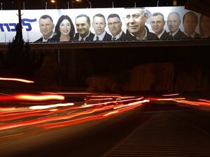 A picture taken on April 7, 2019 shows a Likud party electoral billboard for Israel's upcoming general elections bearing the portrait of Prime Minister Benjamin Netanyahu (C) and his party candidates in Jerusalem. 
Ahmad GHARABLI / AFP