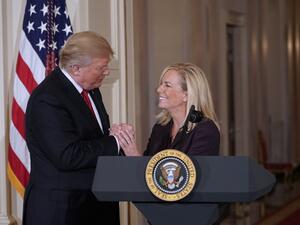 US President Donald Trump clasps hands with Kirstjen Nielsen after nominating her to be the next Homeland Security Secretary in the East Room of the White House in Washington, DC. US President Donald Trump  (AFP)