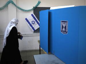 An Arab Israeli woman prepares to cast her vote during Israel's parliamentary elections on April 9, 2019 in Daliyat al-karmel in northern Israel. (Jalaa MAREY / AFP)