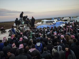 Syrians fleeing the northern embattled city of Aleppo wait on February 5, 2016 in Bab-Al Salama, next to the city of Azaz, northern Syria. (AFP/Bulent Kilic)