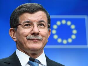 Turkey's Prime Minister Ahmet Davutoglu addresses a press conference at the end of an EU leaders summit with Turkey centered on the the migrants crisis, at the European Council, in Brussels on March 8, 2016. (AFP/Emmanuel Dunand)