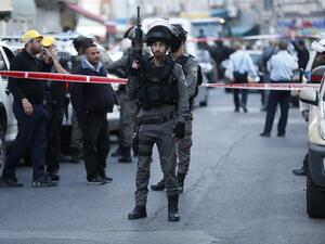 Israeli security forces seal off the area in Arab east Jerusalem's Salahedin street where a shooting attack took place on March 8, 2016. (AFP/Ahmad Gharabli)