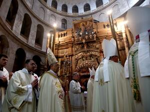 The Latin Patriarch of Jerusalem Fuad Twal (3L) leads the Easter Sunday procession at the Church of the Holy Sepulchre in Jerusalem’s Old City on March 27, 2016. (AFP/Gali Tibbon)
