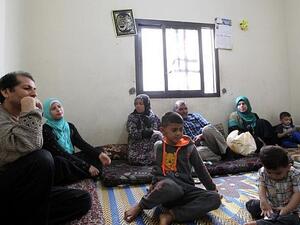 A Syrian family rest in a room where they are residing in the Shatila Palestinian refugee camp on the southern outskirts of the Lebanese capital, Beirut, April 5, 2016. (ANWAR AMRO/AFP)