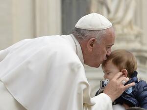 Pope Francis kisses a baby as he arrives for his weekly general audience at St Peter's square on September 30, 2015 at the Vatican. (AFP/Andreas Solaro) Pope Francis kisses a baby as he arrives for his weekly general audience at St Peter's square on September 30, 2015 at the Vatican. (AFP/Andreas Solaro)