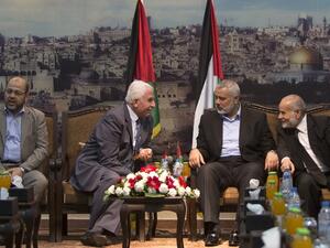 Hamas and Fatah officials discuss reconciliation in Gaza, Tuesday, April 22, 2014. (AFP/Mahmud Hams)
