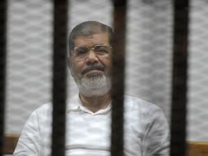 Deposed former president Mohamed Morsi in court (AFP/File Photo)
