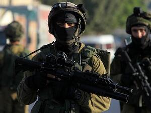 Palestinian security sources said more than 20 Israeli military jeeps raided the Surra village following the attack in search of the shooters (AFP/File)