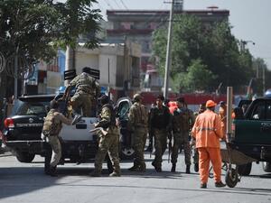 Security forces in Kabul leave the site of Monday's bombing. (WAKIL KOHSAR / AFP)