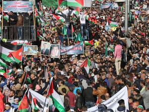 Protesters shout slogans and wave Palestinian flags during a demonstration against the U.S. president's decision to recognize Jerusalem as the capital of Israel, on Dec. 8, 2017, in the Jordanian capital Amman (Khalil Mazraawi/AFP)