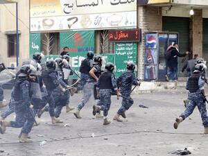 Lebanese security forces run after protestors during a demonstration outside the US embassy in Awkar, on the outskirts of the Lebanese capital Beirut, on Dec. 10, 2017, to protest against Washington's decision to recognize Jerusalem as the capital of Israel (ANWAR AMRO/AFP)