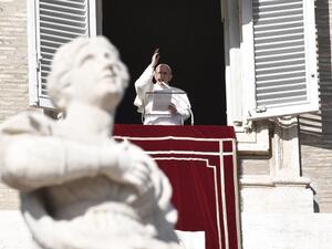 Pope Francis addresses the crowd from the window of the apostolic palace overlooking St Peter's Square on Dec. 17, 2017, in the Vatican (Andreas SOLARO/AFP)
