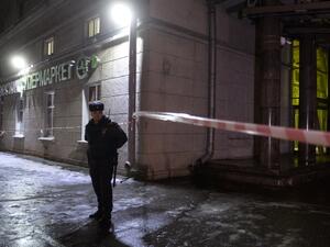 A police officer cordons off the site of a blast in a supermarket in Saint Petersburg on Dec. 27, 2017. 
(Olga MALTSEVA / AFP)