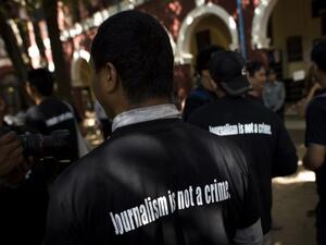 Local journalists stand outside the courthouse as Reuters journalists Kyaw Soe Oo and Wa Lone appear in court in Yangon on Jan. 10, 2018 (YE AUNG THU / AFP)


