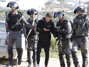 Israeli forces detain a Palestinian youth during clashes following a demonstration calling for the release of Palestinian prisoners from Israeli jails, on Jan. 13, 2018, in the West Bank village of Nabi Saleh (ABBAS MOMANI / AFP)