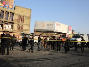 Iraqi security forces cordon off the area where a double suicide bombing killed more than 20 people in central Baghdad on Jan. 15, 2018, the second such attack in the Iraqi capital in three days (SABAH ARAR / AFP)


