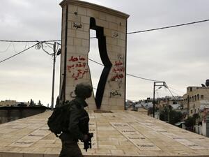 A member of the Israeli forces walks during a military operation in Jenin, in the north of the occupied West Bank, on Jan. 18, 2018 (Jaafar ASHTIYEH / AFP)