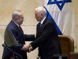 U.S. Vice President Mike Pence (R) shakes hands with Israeli Prime Minister Benjamin Netanyahu at the parliament in Jerusalem on Jan. 22, 2018 (ARIEL SCHALIT / POOL / AFP)
