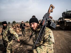 Turkish troops advance near the Syria border at Hassa, Hatay province, on Jan. 22, 2018, as part of the operation "Olive Branch" (BULENT KILIC / AFP)