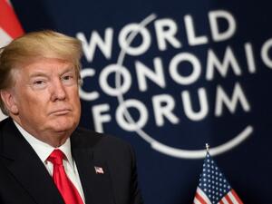U.S. President Donald Trump looks on as he sits next to the logo of the World Economic Forum (WEF) annual meeting on January 26, 2018 in Davos, eastern Switzerland. 
(Fabrice COFFRINI / AFP) U.S. President Donald Trump looks on as he sits next to the logo of the World Economic Forum (WEF) annual meeting on January 26, 2018 in Davos, eastern Switzerland. 
(Fabrice COFFRINI / AFP)