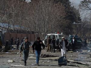 Afghan volunteers and policemen carry injured men on an ambulance at the scene of a car bomb exploded in front of the old Ministry of Interior building in Kabul on January 27, 2018. An ambulance packed with explosives blew up in a crowded area of Kabul on January 27, killing at least 17 people and wounding 110 others, officials said, in an attack claimed by the Taliban. 
(WAKIL KOHSAR / AFP)