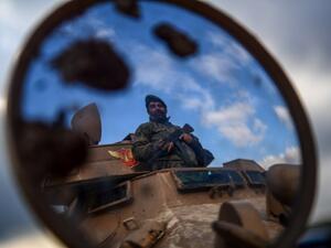 A Turkish-backed Syrian rebel fighter mans a checkpoint in the Syrian town of Azaz, on a road leading to Afrin, on Jan. 27, 2018 (Ozan KOSE / AFP)
