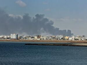 Smoke billows in the government's de facto capital Aden, as fighters from the separatist Southern Transitional Council move closer to taking full control of the southern city, on Jan. 30 (SALEH AL-OBEIDI / AFP)
