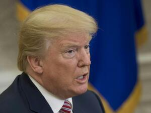 US President Donald Trump speaks to the press in the Oval Office of the White House in Washington, DC, Feb. 9, 2018. 
(SAUL LOEB / AFP)
