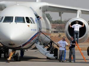  This file photo taken on March 5, 2010 in Hyderabad shows technicians and officials standing beside an Antonov An-148 aircraft on display during The India Aviation 2010 show at Begumpet Airport (Noah SEELAM / AFP)