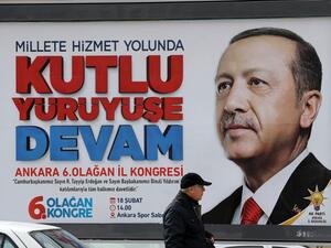 A billboard displays an image of President of Turkey and Leader of the Justice and Development Party (AK Party) Recep Tayyip Erdogan reading "continue the blessed march " in Ankara, on Feb. 14, 2018, four days ahead of the party's 6th ordinary congress in the Turkish capital. 
(ADEM ALTAN / AFP)