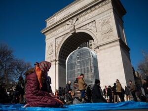 NEW YORK, NY - JAN. 26: Muslims pray following a protest to the mark the one year anniversary of the Trump administration's executive order banning travel into the United States from several Muslim majority countries, in Washington Square Park, New York City. (Drew Angerer/Getty Images/AFP) 