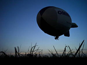 Blimp flying over a meadow (AFP/File Photo)