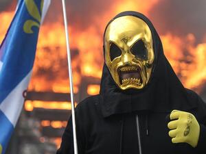 The protesters were attempting to march on the Elysee Palace, Mr Macron's official home, but were held back by barriers and rows of police (AFP)