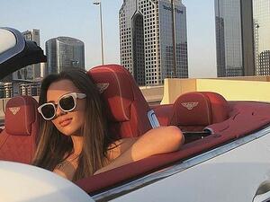 Maria', whose full name is not known, is seen behind the wheel of a Bentley (Instagram)