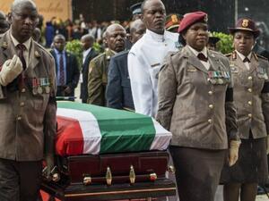  Members of the South African military carry the coffin of long-time activist Winnie Mandela who was laid to rest in a state funeral (AFP/File Photo)