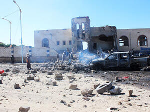 People inspect damage at the site of air strikes (AFP/File Photo)