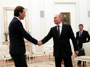 Austria's Chancellor Sebastian Kurz in previous meeting shakes hands with Russia's President Vladimir Putin (AFP/File Photo)	