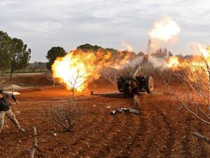 An opposition fighter fires a missile from a village near al Tamanah during ongoing battles with regime forces in Syria's Idlib province. (AFP/File)
