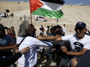 A French-American citizen and two other activists were arrested in the Bedouin village of Khan al-Ahmar. (AFP/File)