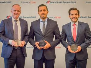 Nayef Al-Smairi center receiving the award.