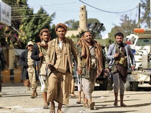 Houthi rebel fighters are seen outside of the residence of Yemen's former President Ali Abdullah Saleh in Sanaa. AFP/Mohammed Huwais