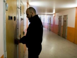 A supervisor locks the door of a cell in a prison (AFP/File Photo)	