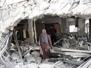 A Palestinian woman walks amid the rubble of a house after Israeli security forces demolished the homes of two convicted Palestinian terrorists in Jabal Mukkaber in East Jerusalem, October 6, 2015. (AFP/File)