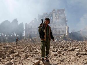 Yemeni soldier stands amongst the rubble as a result of the destructive conflict (AFP/File Photo)	