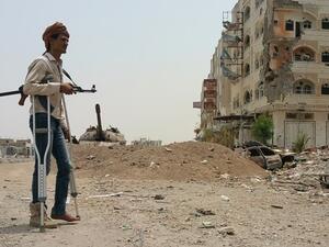 A fighter walks with crutches in Yemen's second city of Aden (AFP/File Photo) 