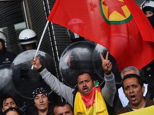 Protesters wave a Kurdistan Workers' Party (PKK) flag at the European Parliament in Brussels, Oct 7, 2014. (AFP/File)