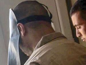 Belgian jihadist Tarik Jadaoun, known by his nom de guerre Abu Hamza al-Beljiki, being escorted out of the court after his trial in Baghdad (AFP/File Photo)	