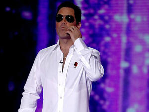 Twinning: Robbie Williams bared a scarily similar resemblance to Simon Cowell on Saturday night as he transformed into the music mogul for the Halloween episode of X Factor (Dymond Thames - Syco - REX - Shutterstock) Twinning: Robbie Williams bared a scarily similar resemblance to Simon Cowell on Saturday night as he transformed into the music mogul for the Halloween episode of X Factor (Dymond Thames - Syco - REX - Shutterstock)