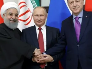 Best of Friends: Rouhani, (L), Putin (C) and Erdogan prepare to talk politics on Syria in Ankara meeting, Wednesday  (AFP/File Photo)	