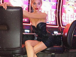 Gambling woman: Elsa Hosk had a great time in Las Vegas this week as she stopped by the Revolve party. The blonde bombshell shared a sultry image to Instagram where she wore a strapless minidress in black as she sat in front of slot machines in a casino (Source: Elsa Hosk - Instagram) Gambling woman: Elsa Hosk had a great time in Las Vegas this week as she stopped by the Revolve party. The blonde bombshell shared a sultry image to Instagram where she wore a strapless minidress in black as she sat in front of slot machines in a casino (Source: Elsa Hosk - Instagram)